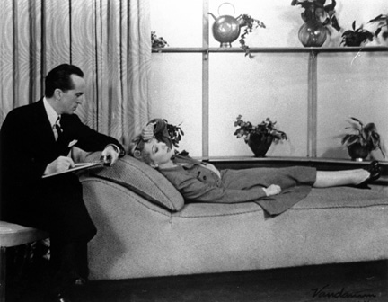 Gertrude Lawrence as Liza Elliott in the original Broadway production of LADY IN THE DARK, 1941. Liza reveals her worries to her psychiatrist, Dr. Brooks (Donald Randolph). Gertrude Lawrence as Liza Elliott in the original Broadway production of LADY IN THE DARK, 1941. Liza reveals her worries to her psychiatrist, Dr. Brooks (Donald Randolph).