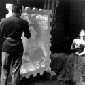 Gertrude Lawrence as Liza Elliott in the original Broadway production of LADY IN THE DARK, 1941. Liza Elliott’s portrait is painted for the 2-cent stamp during the Glamour Dream. Gertrude Lawrence as Liza Elliott in the original Broadway production of LADY IN THE DARK, 1941. Liza Elliott’s portrait is painted for the 2-cent stamp during the Glamour Dream.